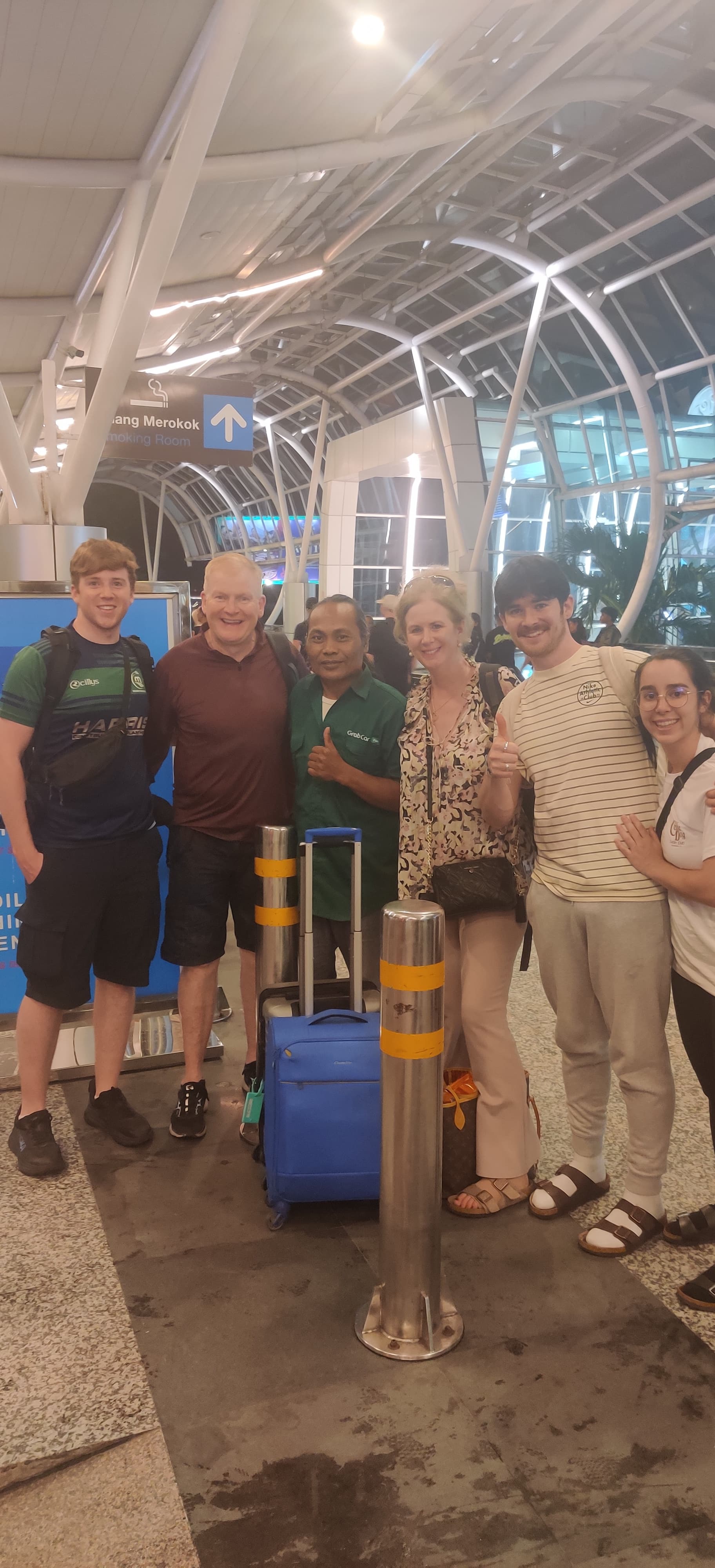 Family group at Bali airport night