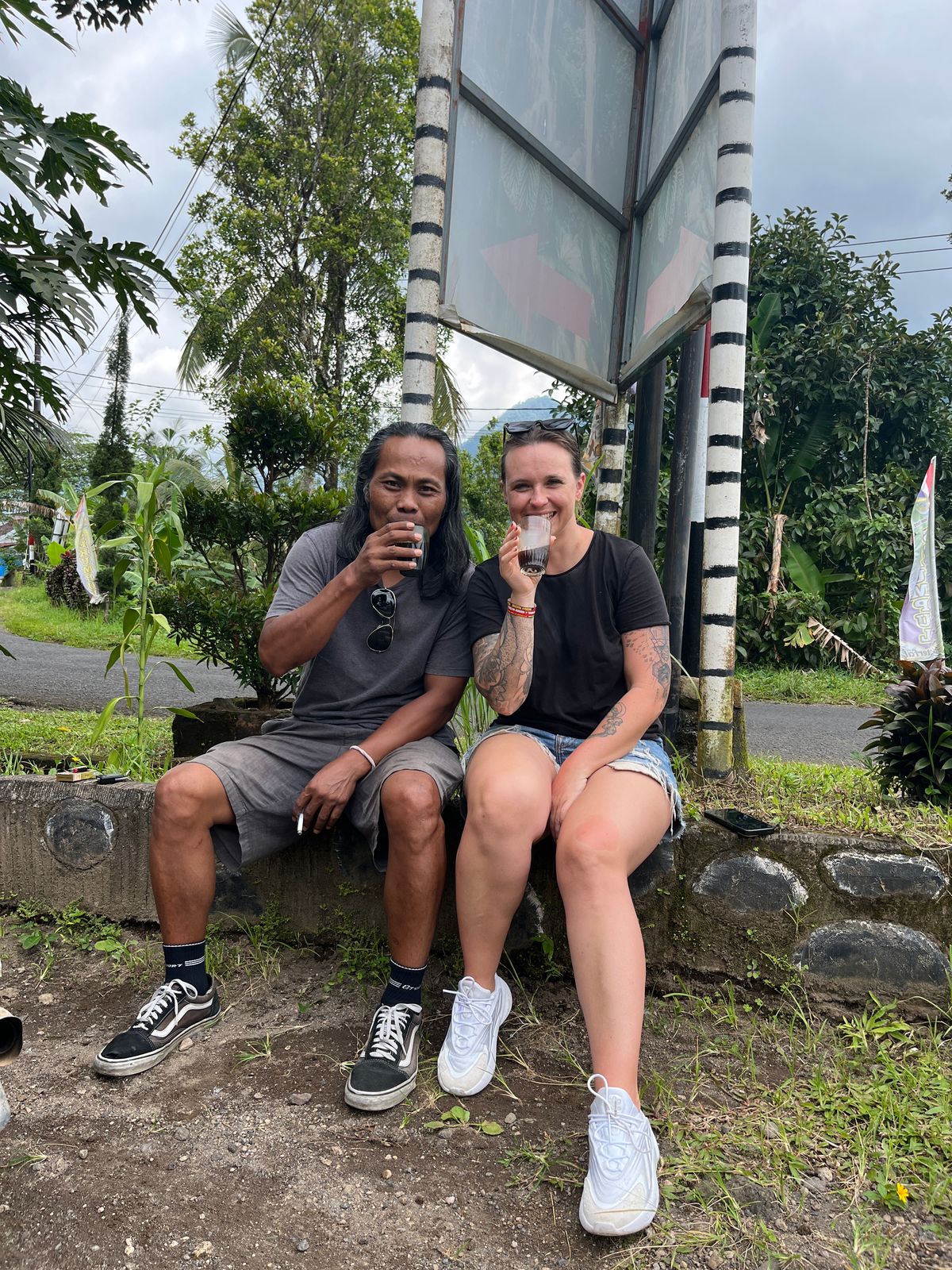 Guide enjoying local coffee with client
