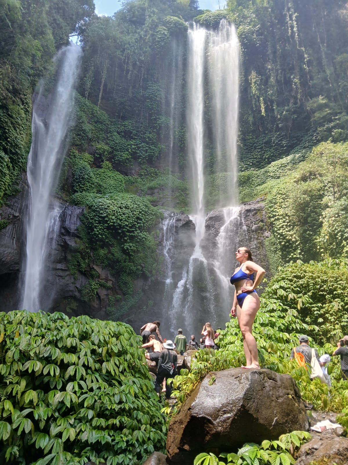 Guest on rock at Sekumpul waterfall